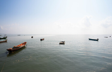 Fishing boat anchored on the shore of the sea in Thailand.