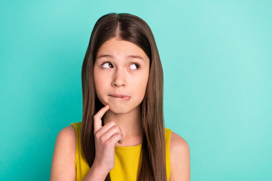 Photo of sad nice brown hair girl look empty space wear yellow dress isolated on bright teal color background