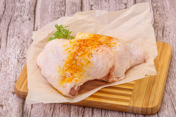 Raw chicken thigh with spices