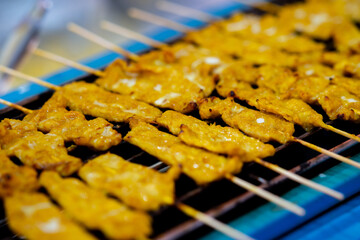 Close up of grilled pork satay, thai street food market