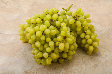 Green grape branch over background