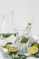 Detox water with lime fruit and mint leaves. Mint fresh homemade lemonade