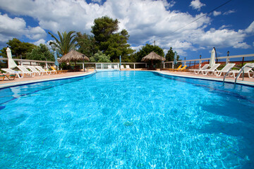 Fototapeta na wymiar Swimming pool at holiday villa in Greece.
