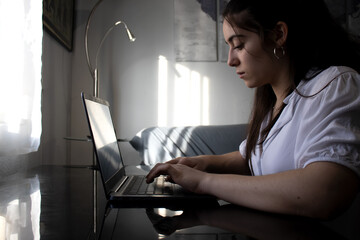 Woman using her laptop at home
