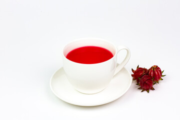 Roselle tea or Hibiscus sabdariffa juice in white ceramic cup and fresh roselle isolated on white background. Drink herbal water for health care.