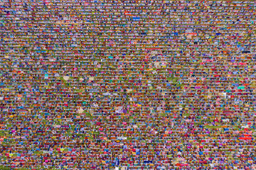 Aerial view of a vast crowd of people worshipping at Gore Shahid park in front of Eid Gah Minar religious site in Dinajpur, Rangpur, Bangladesh.