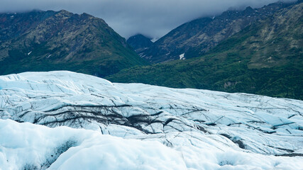 Fototapeta na wymiar Blue and white glacier in cold beautiful Alaska