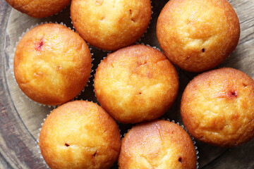 Delicious fresh muffins with berry filling, top view