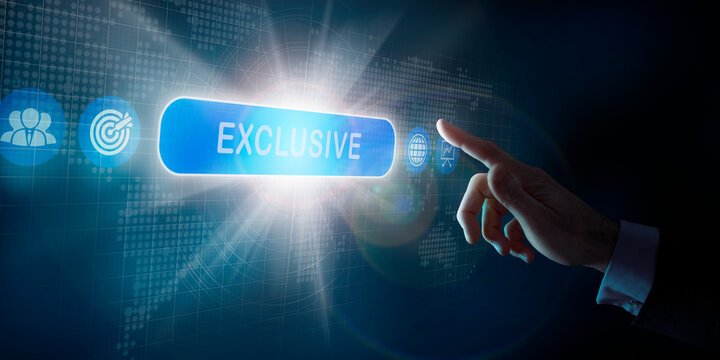 A businessmans hand selecting an Exclusive business word concept on a computer display.