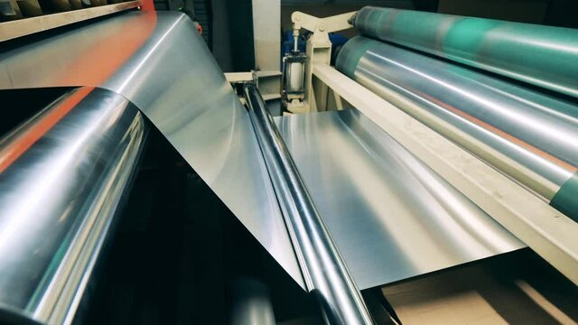 Sheet of metal material is moving through the rolling transporter