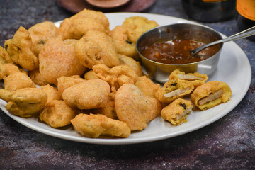 Mushroom bhaji snack. Battered mushrooms served with tamarind chutney