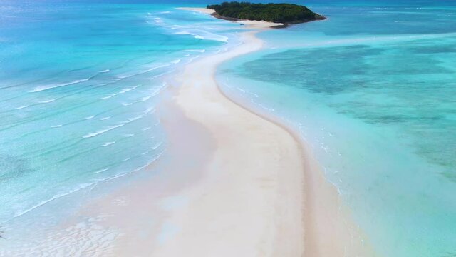 Aerial orbit and dolly of incredible Nosy Iranja island spit off a short cruise from Nosy Be, Madagascar