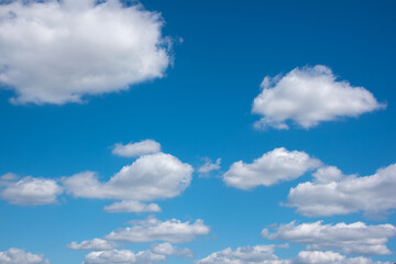 Obraz na płótnie Canvas blue sky and white fluffy clouds