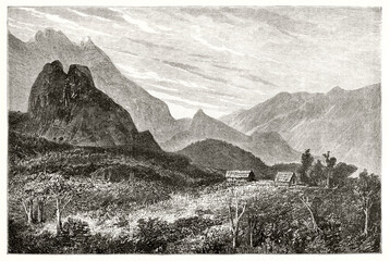 two isolated little houses surrounded by huge natural landscape in Cirque de Cilaos, Reunion island. Ancient grey tone etching style art by De Berard, Magasin Pittoresque, 1838 - 418105562