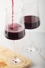 Red wine in a transparent white glass