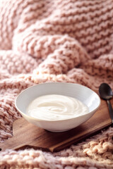 Obraz na płótnie Canvas White greek yogurt in a bowl for breakfast