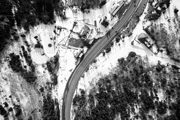 Aerial view on mountain road from drone in winter.