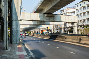road in city under grand motorway construction and vehicel traffic