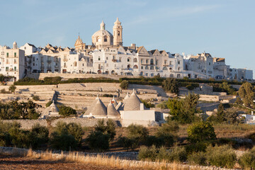 Locorotondo, Bari. Veduta del borgo con i Trulli e cupola con campanile della Chiesa Madre...