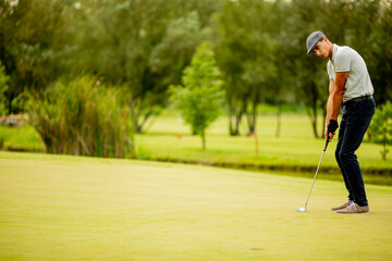 Young man playing golf