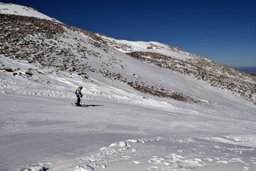 Ski resort ski run with skier