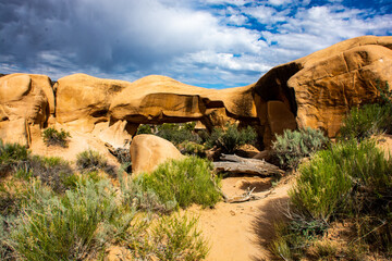 Devils Garden, Hole in the Rock Trail, Grand Staircase National Monument . red sandstone arch with storm clouds
