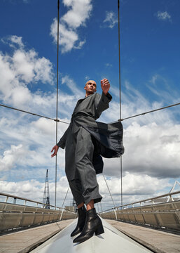 Low Angle View Of Male Fashion Model Posing In City