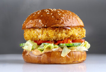 Shrimp burger, a cutlet made with minced shrimp. With cheese, tomatoes and sesame seed bun.