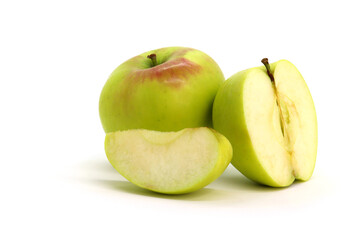 Green apple whole and sliced on white background isolated