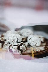  a plate of cakes, only from the oven, sprinkled with powdered sugar