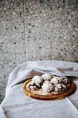 a plate of cakes, only from the oven, sprinkled with powdered sugar