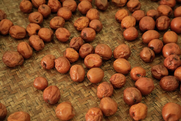 Dried red date or Chinese Jujube on bamboo mat, Organic Chinese Jujube for healthy.