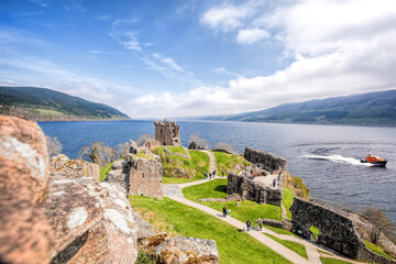 Ruins of Urquhart Castle with famous lake Loch Ness in Scotland - 418122306