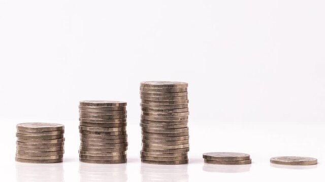 4k stop motion five piles of gold money coins decreasing fading disappear on white background, financial trading concept.
