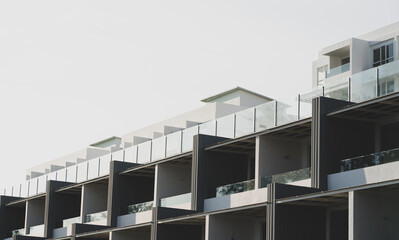 Newly built condominiums. Stylish exterior apartment photographed in a minimalist style.