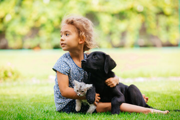 Pets giving their love to small children - 418128537