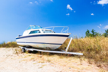 Fototapeta premium Old boat on sandy beach on coastline of Adriatic Sea, Montenegro