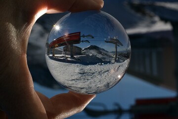 Cable car ski resort ski run and glass ball