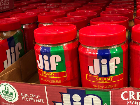 BAXTER, MN - 3 FEB 2021: Store display of Peanut Butter for sale. Jif is an American brand of peanut butter made by The J.M. Smucker Company, Red and blue jars.