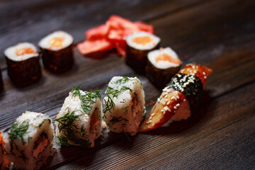sushi rolls chopsticks japanese cuisine delivery meal wooden table