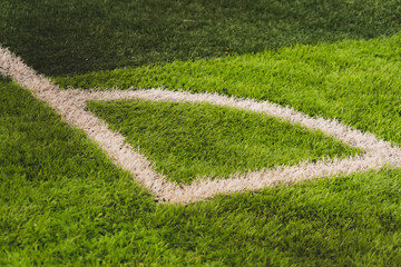 Naklejka premium football corner on green field.