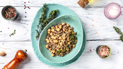 Buddha bow with quinoa salad with chickpeas and thyme. Super food on a white background, top view