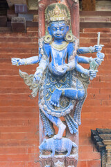 Many arms statue on a carved wooden roof strut, Mul Chowk, Hanuman Dhoka Royal Palace, Patan Durbar Square, Unesco World Heritage Site, Kathmandu valley, Lalitpur, Nepal, Asia