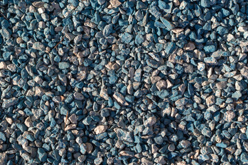 Turquoise gravel, stones two colors - turquoise and gray. Bright construction background for advertising
