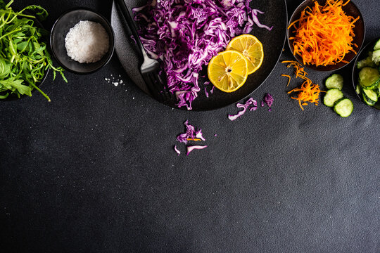 Red cabbage, rocket, carrot and cucumber with salt and lemon