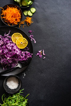 Red cabbage, rocket, carrot and cucumber with salt and lemon