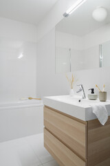 Fototapeta na wymiar Bathroom washbasin with wooden cabinet