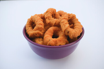 Top view of south indian traditional snack item, evening tea time item Chegodilu or Ring murukku isolated on white background in white plate served during festival