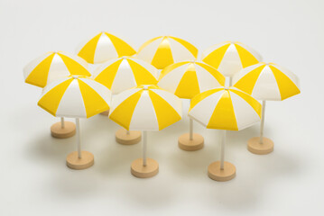 Yellow umbrellas on a white background.