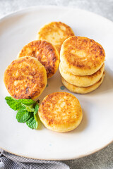 cheesecakes breakfast or dessert syrniki curd cottage cheese pancakes healthy meal top view copy space for text food background rustic image